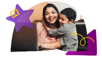 Mom and son laughing and looking at a laptop screen