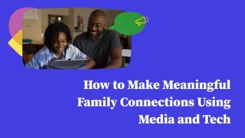 Father and son looking at a device