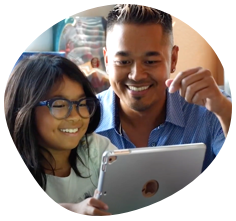 Dad and daughter looking at tablet